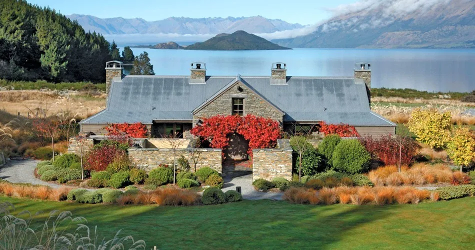 A lodge set among gardens on the shore of Lake Wakatipu.