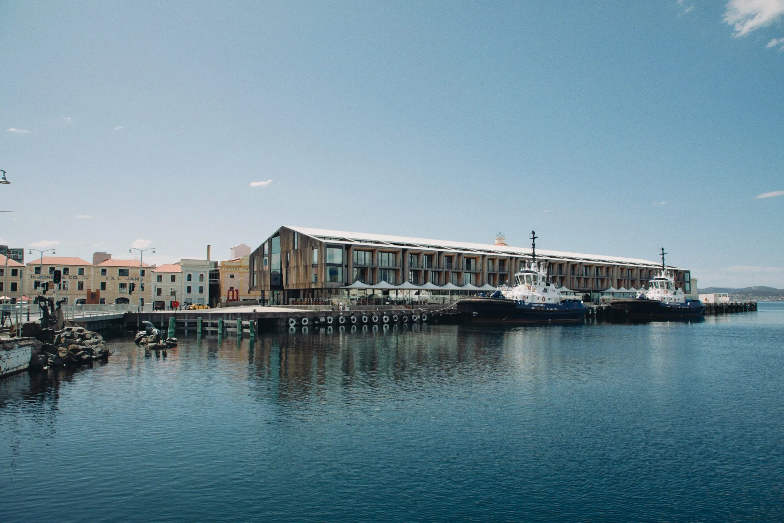 The MACq 01 waterfront hotel stands beside Hobart's harbor.